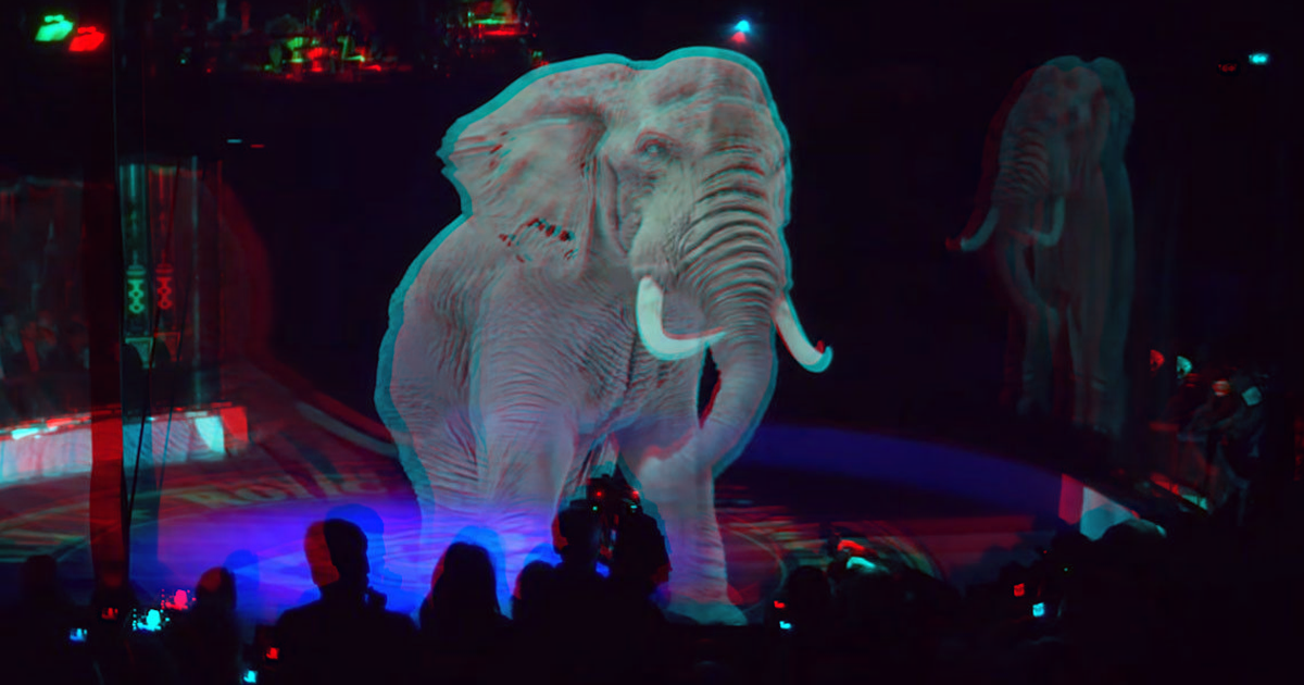 Sala com um holograma de um elefante.